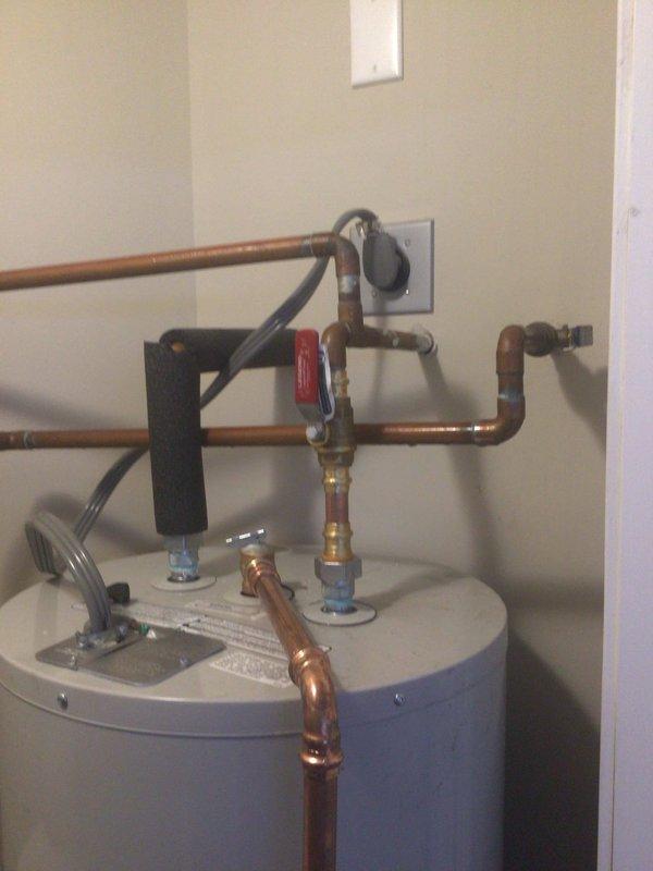 Diagnosed 20-year-old AO Smith Electric 50 Water Heater with active leak causing floor damage. Inspection revealed end-of-life unit with compromised tank integrity, requiring complete replacement to prevent further property damage.