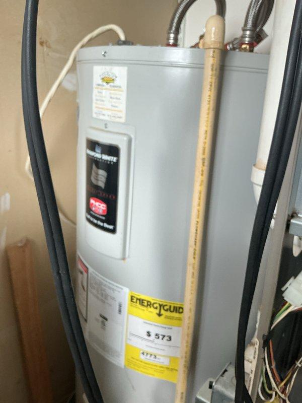 Performed Basic Monthly maintenance service on HVAC system (CCH). Inspected and photographed blower wheel assembly which showed minor dust accumulation but remains in functional condition. Also documented water heater installation with proper connections including flexible stainless steel water lines and PVC venting pipe.