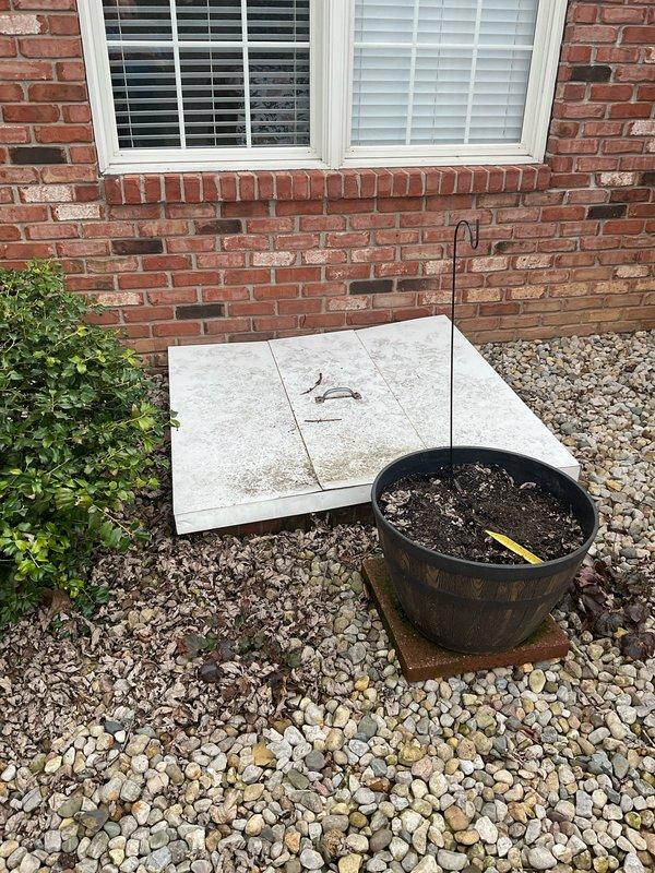 Conducted site assessment of residential property to evaluate conversion from existing heat pump system to gas heating system. Inspected exterior gas meter installation and connection points to determine capacity for supporting new gas furnace. Confirmed appropriate exterior space for potential equipment placement near windows with adequate clearance from landscaping elements.