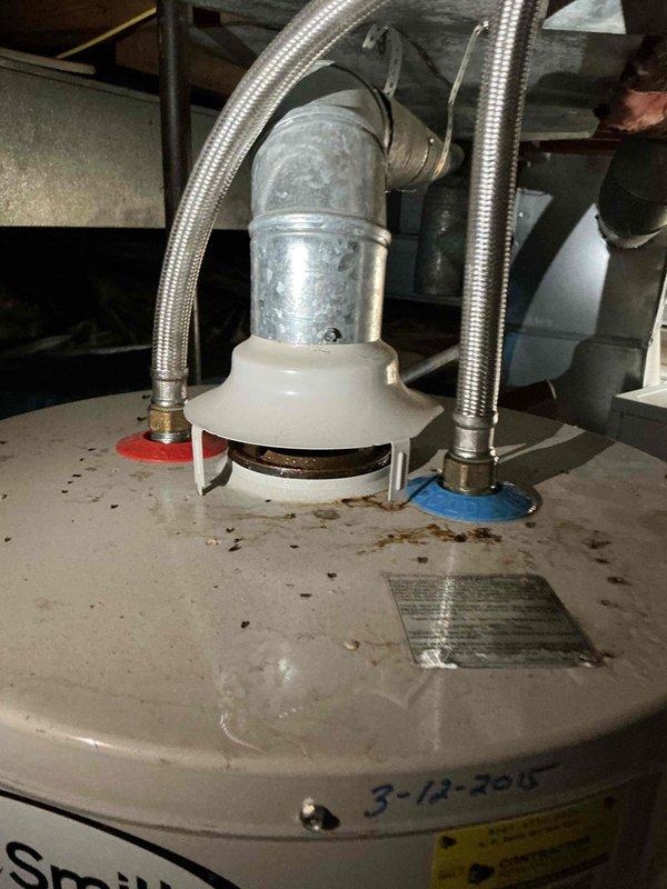 Performed diagnostic assessment on non-functioning water heater. Visual inspection revealed significant corrosion at connection points and aging components (installed approximately 2015-2020). Observed moisture accumulation and potential electrical issues with wiring connections. Estimate provided for replacement of the deteriorated unit.