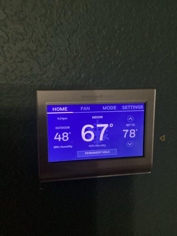 Responded to no-cooling complaint for upstairs system. Diagnostic testing revealed thermostat was improperly programmed with temperature set to 78°F while indoor temperature was 67°F (system not calling for cooling). Reprogrammed thermostat to appropriate cooling setpoint and verified proper system operation.