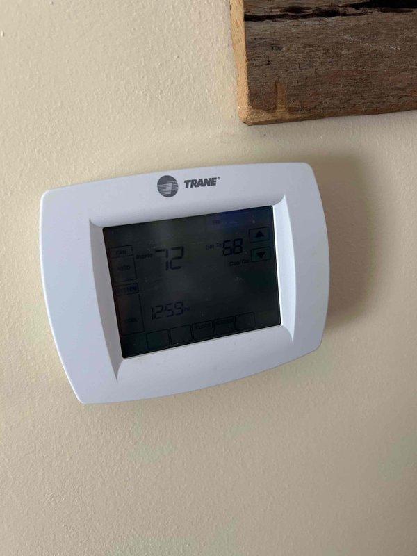 Performed scheduled heating maintenance service on Trane system. Inspected thermostat operation which was functioning correctly at set temperature of 72°F. Examined outdoor condensing unit, verified proper installation on gravel base with intact refrigerant lines and no visible damage. Customer has CCH coverage with renewal due 6/23/26.