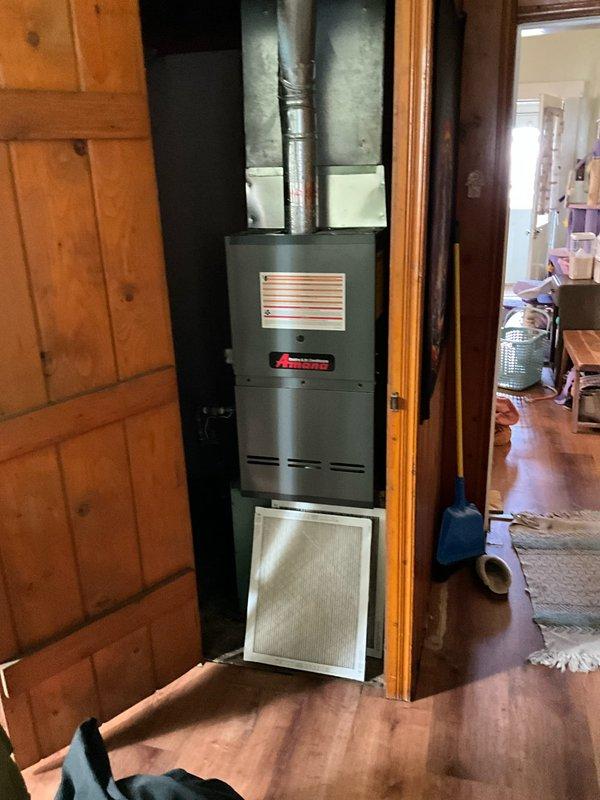 Conducted assessment of existing HVAC system housed in wooden cabinet enclosure, confirming refrigerant depletion as reported. Evaluated current furnace unit with connected ductwork and provided customer with replacement options for complete system upgrade. Customer has requested expedited replacement timeline and has been informed of next steps in the installation process.