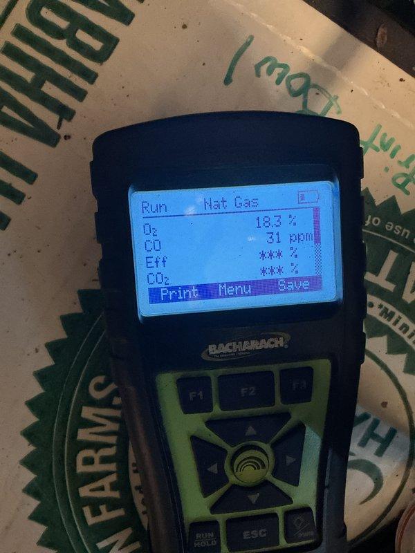 Performed basic monthly heating maintenance service on CCH system. Conducted combustion efficiency testing using Bacharach analyzer, which showed O₂ at 18.3% and CO at 31ppm. Inspected motor assembly, pulley system and electrical connections (#122 component) to ensure proper operation.