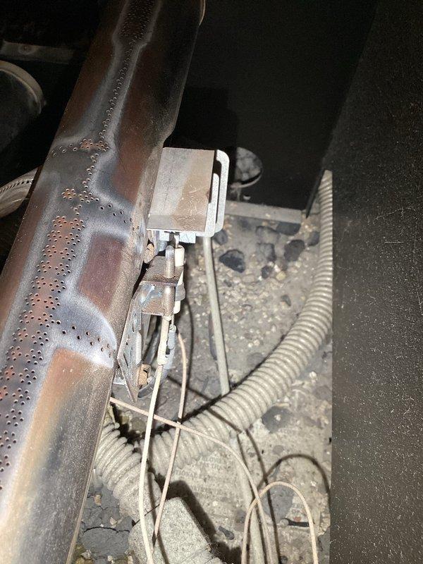 Conducted gas leak investigation and pressure test on bedroom gas fireplace with non-functioning ignition system. Inspected gas line components and found perforations in metal piping causing gas leakage. Repaired damaged sections of the gas line and replaced corroded ignition assembly components, then performed successful pressure test confirming system integrity. Fireplace now operating safely with proper gas flow and ignition.