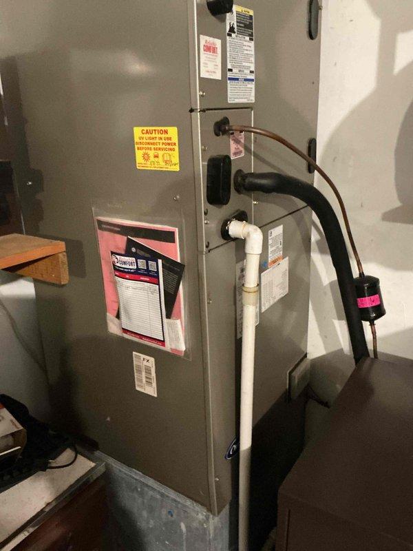 Performed monthly basic maintenance on CCHP-Heating system. Inspected Honeywell thermostat confirming proper operation with heat set to 74° and actual temperature reading 72° with "Heat On" status active. Visually examined furnace unit including gas line connections, condensate drain, and safety components - all functioning correctly.