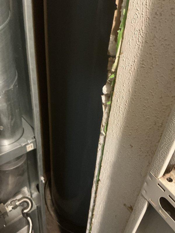 Performed annual heating maintenance service on customer's system with a CCH agreement (expired but payment due). Installed new 16x20x1 filter as part of service. Documented concerning wall deterioration and possible moisture intrusion near equipment installation with visible green discoloration that may indicate mold growth in the mechanical space.