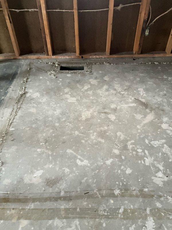 Conducted site assessment for complete HVAC system and line replacement following fire damage. Inspection revealed exposed framing, damaged concrete flooring with cutouts, and compromised electrical components requiring full system replacement. Documented existing ductwork configuration and structural conditions to prepare comprehensive replacement estimate for restoration of the fire-damaged HVAC infrastructure.