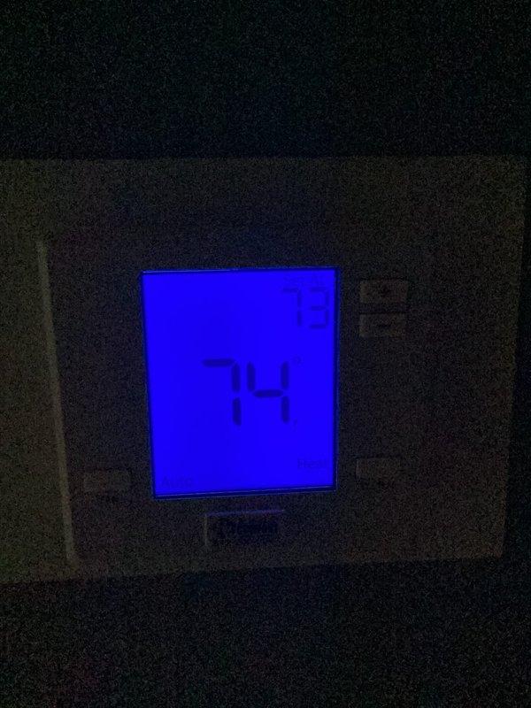 Performed scheduled heat maintenance service that was rescheduled from previous date. Inspected thermostat functionality - confirmed proper operation with system maintaining 74° setpoint. Examined outdoor Goodman condensing unit, checked connections and verified proper installation on concrete pad.
