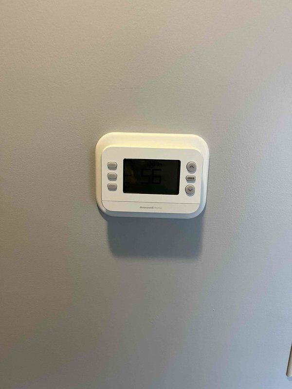 Successfully installed a complete Lennox HVAC system consisting of a new gas furnace and AC unit for residential application. System includes proper venting with PVC exhaust pipes, secure gas line connections, and condensate drain line installation. Mounted and programmed a new Honeywell digital thermostat to control the system, confirming proper functionality of all components before completion.