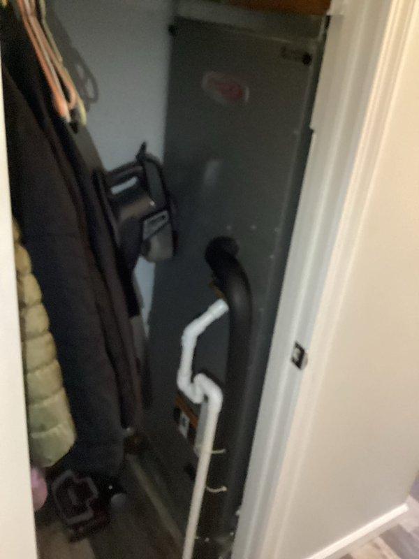 Performed comprehensive HVAC system maintenance service including inspection of furnace/air handler unit, verification of proper condensate drain line configuration, and confirmation of thermostat functionality (Honeywell digital model showing proper temperature reading of 72°F). Provided customer with maintenance plan information as requested.