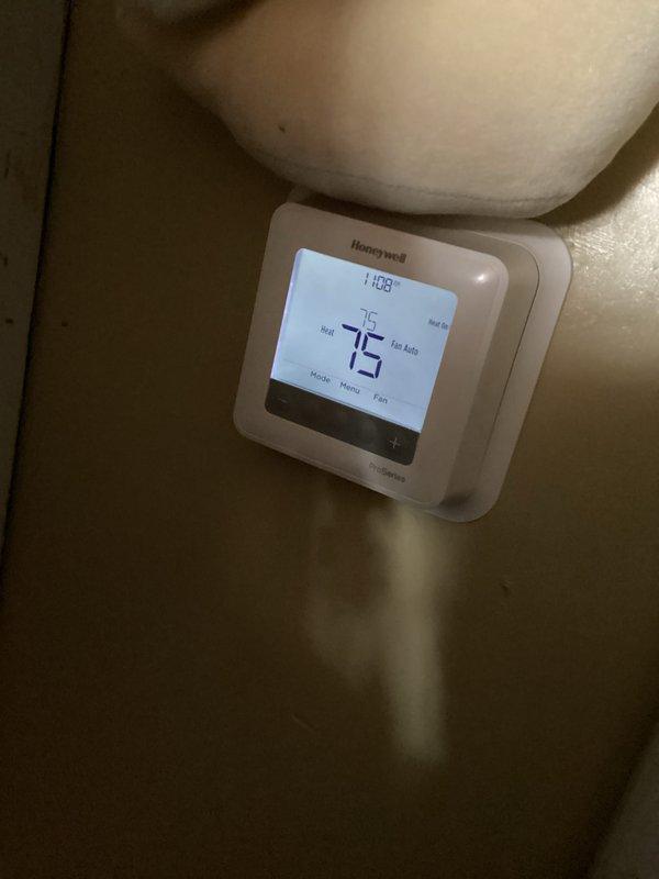 Performed CCH Basic Heat Maintenance service. Verified thermostat functionality with proper temperature display (75°F/76°F setpoint) and fan auto operation. Conducted electrical testing with Fieldpiece SC260 meter showing 24.6V at control circuit. System operating within normal parameters.