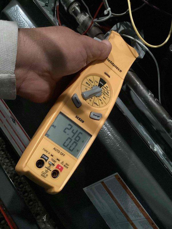 Performed CCH Basic Heat Maintenance service. Verified thermostat functionality with proper temperature display (75°F/76°F setpoint) and fan auto operation. Conducted electrical testing with Fieldpiece SC260 meter showing 24.6V at control circuit. System operating within normal parameters.