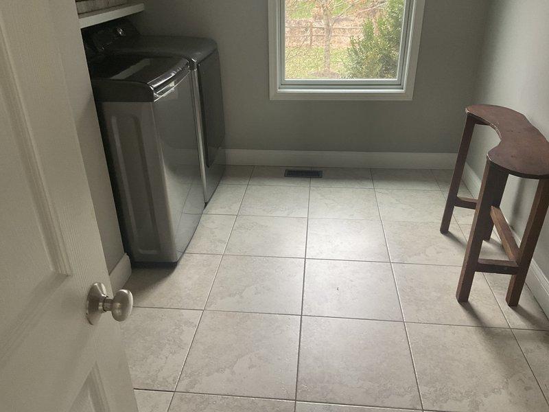 Conducted comprehensive assessment of residential duct system for cleaning estimate. Inspected floor register in tiled utility room and evaluated system access points. Noted thermostat location and discussed potential scope of work with homeowner who is obtaining multiple estimates for comparison.