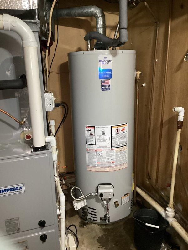 Successfully replaced a 50-gallon natural gas water heater in customer's basement utility room. Installation included connecting all required plumbing components, establishing proper venting, and ensuring secure mounting of the unit adjacent to the existing Tempstar HVAC system.
