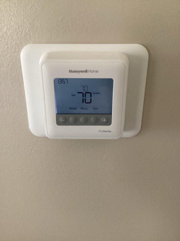 Responded to a complimentary warranty service call regarding furnace knocking noise. Inspected system and identified loose component causing the noise. Secured component and verified proper operation. Thermostat functioning normally at 70° with heat and fan auto settings. Noted some ceiling water damage/mold in utility area that may require future attention.