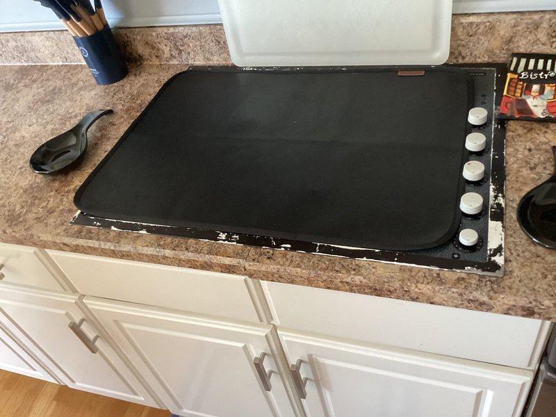 Conducted an estimate for installing a gas line to service a 5-burner cooktop. Inspection of the kitchen revealed an existing countertop installation requiring gas connection. Assessment of the crawlspace confirmed feasibility of running a new gas line through the accessible under-floor area where utilities are already present.