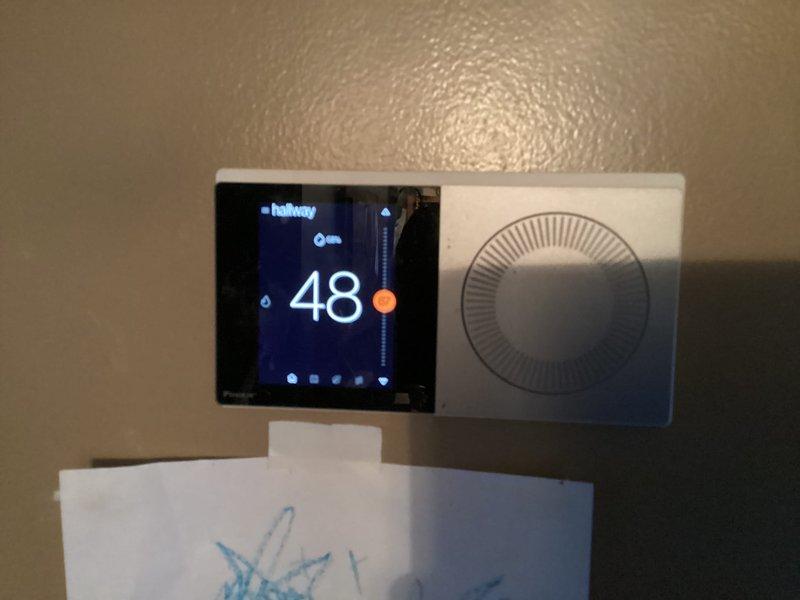 Responded to no-heat service call for system less than 10 years old. Discovered flooding beneath house had saturated air filter and compromised ductwork, with water damage to tubing located under the structure. System power was disconnected for safety. Replaced filter under warranty and documented thermostat reading of 48°F along with control board condition for warranty claim processing.