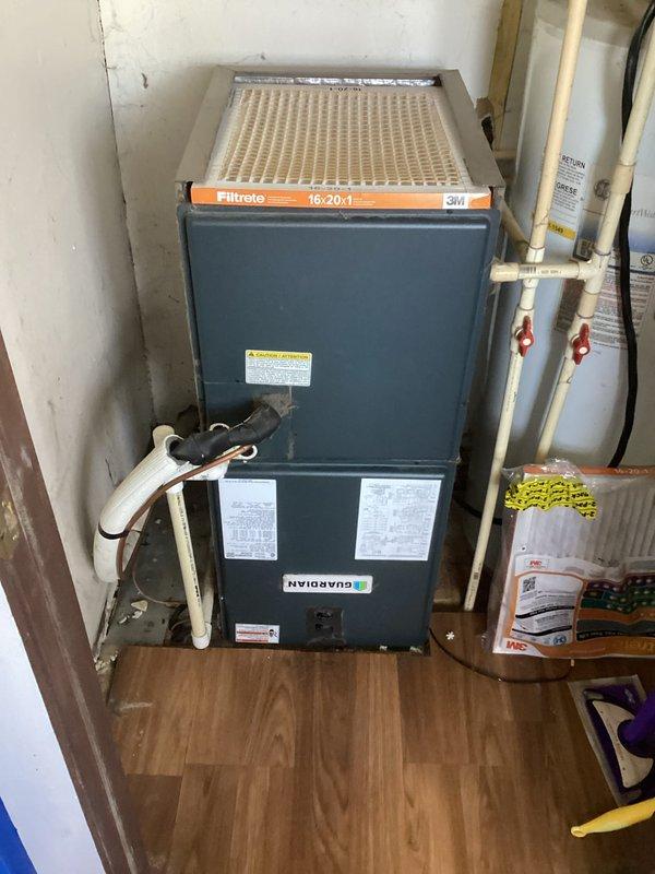 Responded to after-hours emergency call for no heat with unit making buzzing noise. Diagnosed system with 48°F indoor temperature and AUX HEAT indicator active despite Guardian furnace not producing heat. Resolved electrical issue at condensing unit causing contactor to buzz without engaging, restored proper operation with heat output returning to setpoint of 58°F.