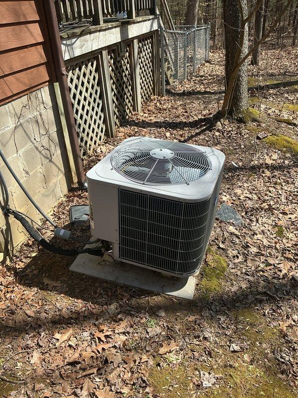 Performed monthly basic heating maintenance service on CCHP system. Inspected Honeywell thermostat displaying 59°F and verified proper operation. Examined outdoor condensing unit, checked for debris accumulation around unit, and confirmed system is functioning within normal parameters.
