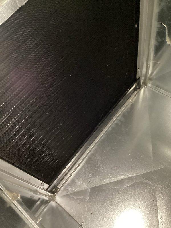 Performed monthly maintenance on commercial HVAC system at CCGH. Inspected heat exchanger coil showing proper operation with normal condensation present. Verified thermostat functionality - unit maintaining 71°F setpoint with Stage 1 heating active and fan running correctly. Filter replacement (16x25x4) not included in this service. Photo documentation taken of key components.