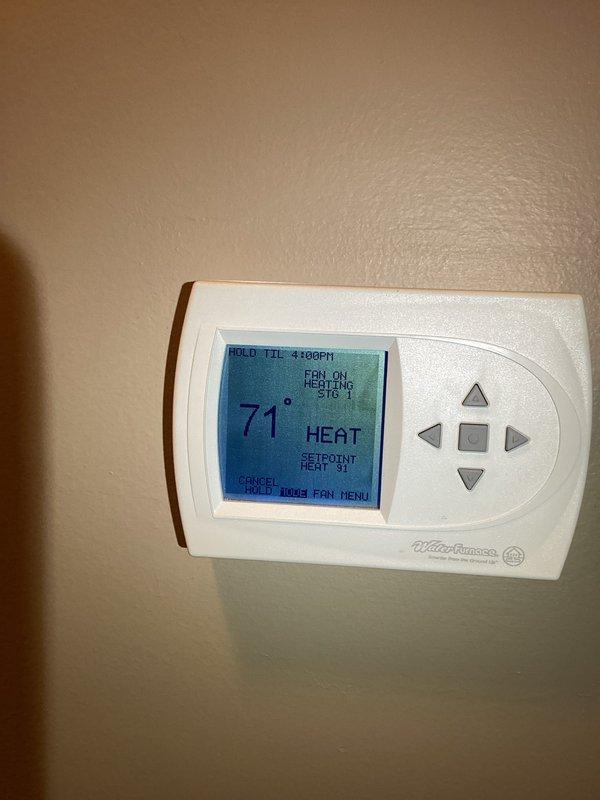 Performed monthly maintenance on commercial HVAC system at CCGH. Inspected heat exchanger coil showing proper operation with normal condensation present. Verified thermostat functionality - unit maintaining 71°F setpoint with Stage 1 heating active and fan running correctly. Filter replacement (16x25x4) not included in this service. Photo documentation taken of key components.
