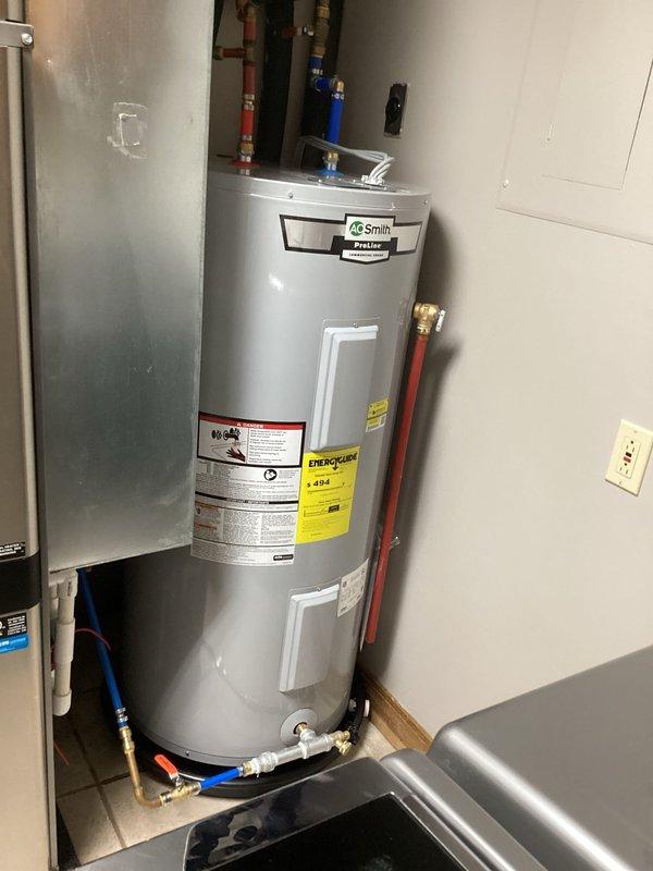 Successfully installed a new 50-gallon short A.O. Smith water heater in the utility closet, including proper connection of hot and cold water lines using PEX piping with appropriate shutoff valves. Additionally, installed a no-salt water conditioner system to improve water quality and extend the lifespan of the new unit, with all connections properly secured and tested for leaks.