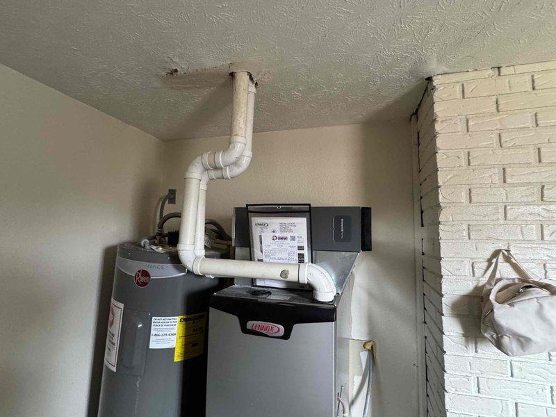 Completed warranty service on a Lennox HVAC system installation, repairing the PVC ventilation piping that connects to the Rheem water heater. Inspected and secured all connection points and elbow joints in the exhaust system, ensuring proper installation and code compliance.