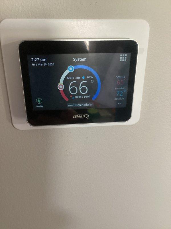 Responded to service call regarding intermittent thermostat malfunction. Inspected Lennox smart thermostat system that previously displayed incorrect temperature readings. Verified proper wiring connections and operation; system currently functioning correctly with accurate temperature display (66°F) and appropriate heat/cool setpoints (65°/72°). Documented filter size for future reference.