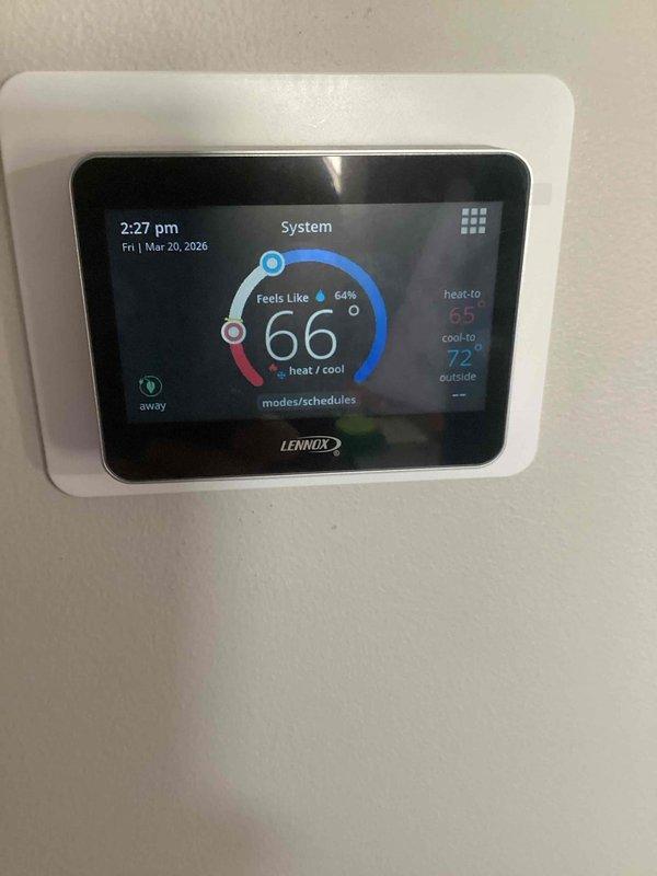 Responded to service call regarding intermittent thermostat malfunction. Inspected Lennox smart thermostat system that previously displayed incorrect temperature readings. Verified proper wiring connections and operation; system currently functioning correctly with accurate temperature display (66°F) and appropriate heat/cool setpoints (65°/72°). Documented filter size for future reference.