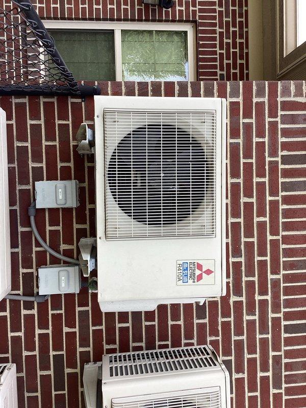 Performed recovery, evacuation, and recharge service on Mitsubishi Electric R410A outdoor condensing unit. System was properly evacuated to manufacturer specifications before recharging. Verified proper operation of both the main outdoor unit and secondary air handler after service.