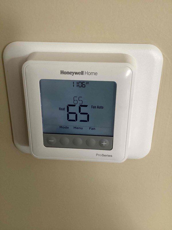 Performed scheduled maintenance on heating system. Inspected Honeywell ProSeries thermostat functionality and confirmed proper heat mode operation. Examined and cleaned blower assembly, noting minor dust accumulation on fan blades.