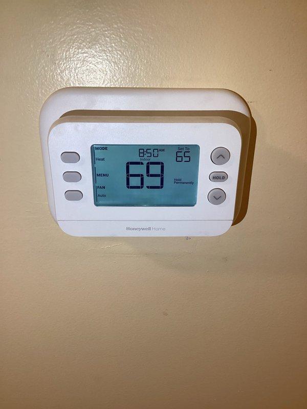 # Service Warranty Summary

Responded to service call for HVAC system with blower running continuously. Upon arrival, accessed property and inspected Honeywell Home thermostat, which was set to Heat mode at 69°F with permanent hold status active. Reviewed furnace control board documentation and DIP switch configuration settings to diagnose continuous blower operation. Corrected thermostat programming and/or furnace control board settings to restore proper system cycling. Verified system returned to normal operation with blower functioning on automatic mode as designed. Unit tested and left in proper working condition.