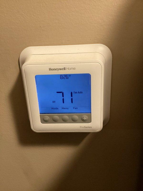 Completed monthly heating maintenance on residential HVAC system including CCH (clean, check, and adjust) procedures with 16x25x1 filter replacement. Verified system operation with current draw reading of 0.62A, confirmed thermostat programming and functionality showing proper temperature control at 71°F with fan in auto mode. All equipment operating within normal parameters with no issues identified.