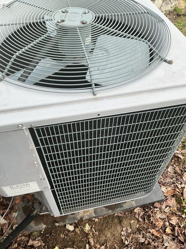 # HVAC Maintenance - Heating System Service Report

Completed annual heating maintenance service on two systems including a cold climate heat pump (CCHP) and boiler unit. Performed comprehensive inspection of heat pump system, verified proper operation of all components, and documented permanent filter size as 21½ x 23½ inches. Inspected outdoor condenser unit, confirmed fan assembly and grille components in good working condition with normal seasonal debris present. Checked refrigerant lines for proper insulation and connections, noting minor condensation present on interior components which is typical for operational equipment. Verified boiler system operation and confirmed both heating systems are functioning properly for continued service through the heating season.