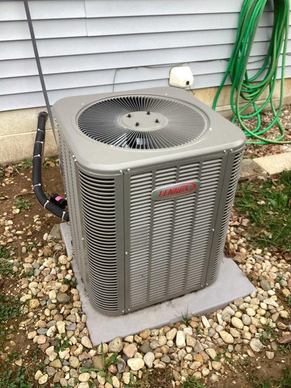 # Service Summary

Responded to service call for non-operational outdoor condenser fan on residential Lennox air conditioning system. Upon arrival, conducted visual inspection of exterior condenser unit and verified customer complaint of fan not spinning. Examined Lennox condenser unit positioned on concrete pad with proper clearance and landscaping. Assessed refrigerant line connections, electrical components, and overall unit condition.

Checked indoor Honeywell Home digital thermostat showing system in OFF mode with fan set to AUTO position. Verified thermostat programming and system settings at control interface. Diagnosed fan motor failure preventing proper condenser operation and heat rejection from refrigeration cycle.

Replaced defective condenser fan motor with OEM-compatible component. Tested capacitor and contactor functionality to ensure proper electrical supply to new motor. Verified proper fan blade rotation direction and secure mounting. Energized system and confirmed co