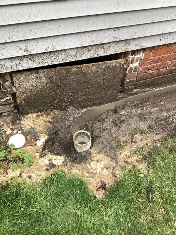 Responded to service call for sewer backup into residence. Upon arrival, located and inspected exterior sewer cleanout access points at foundation level. Documented condition of cleanout pipes and surrounding drainage area, noting soil disturbance and staining patterns consistent with wastewater backup. Marked utility locations on lawn and assessed exterior plumbing access points for main line intervention.