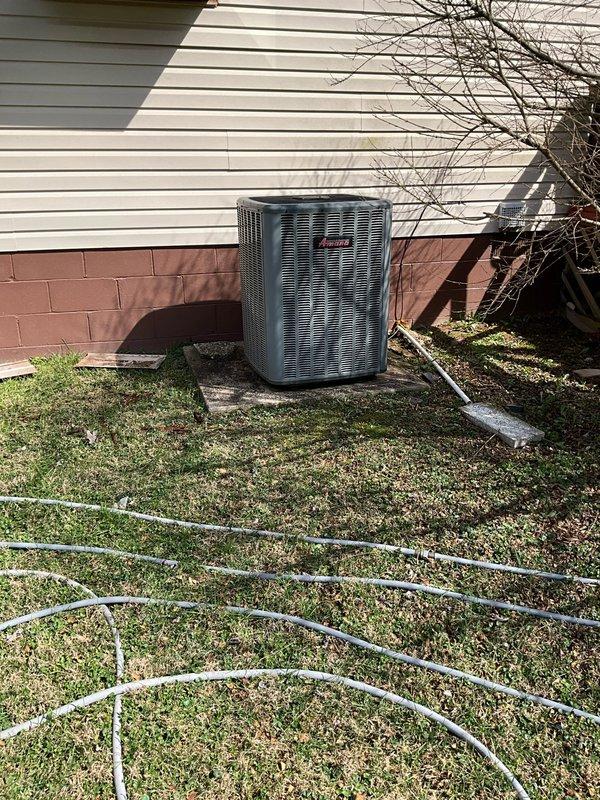 # HVAC System Replacement Summary

Responded to service call for non-operational air conditioning system with complete refrigerant loss. Upon inspection, determined outdoor condensing unit and indoor air handler required full system replacement due to age and condition. Removed existing HVAC equipment including outdoor condenser unit positioned on concrete pad against exterior wall and indoor furnace/air handler located in utility closet adjacent to water heater. Installed new complete HVAC system with appropriately sized equipment for residential application. Completed refrigerant line connections, electrical hookups, and ductwork integration to existing infrastructure. System tested and verified operational upon completion.