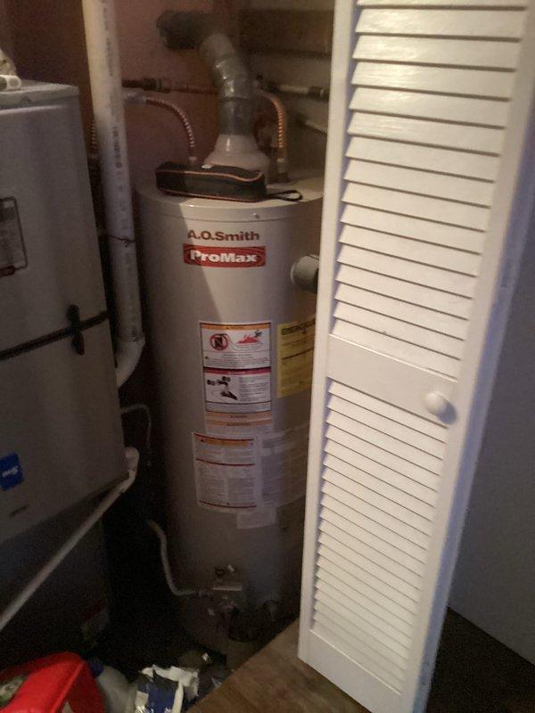 # HVAC Maintenance Service Summary

Completed routine residential air conditioning maintenance service as scheduled. Upon arrival, accessed utility closet housing HVAC equipment including furnace unit and associated mechanical systems. Performed standard preventative maintenance procedures on cooling system in accordance with manufacturer specifications. Documented equipment conditions through photographic records showing A.O. Smith ProMax water heater, gray furnace unit with plenum assembly, and PVC condensate drainage system. All accessible components were inspected and found to be in functional condition. Service completed without complications, and system left in operational status ready for cooling season.