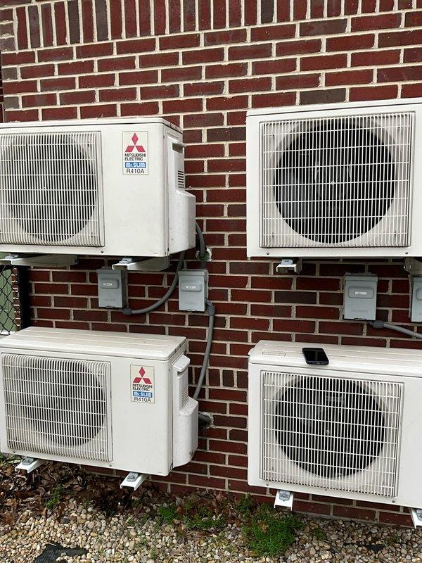 # HVAC Estimate - Replacement Summary

Conducted comfort consultation for full system replacement estimate due to outdoor coil leak on existing unit with unavailable replacement parts. Evaluated current multi-zone Mitsubishi Electric ductless mini-split system installation with multiple outdoor condensers mounted on exterior brick wall. Documented existing equipment configuration and discussed replacement options with customer to address failed component and restore climate control functionality on expedited timeline per customer request.