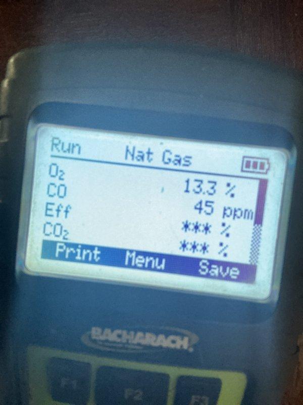 Completed monthly heating maintenance on gas furnace system. Performed combustion analysis showing 45 ppm CO, 13.3% efficiency on natural gas unit. Verified thermostat operation displaying 45°F set point with system running in heating mode. Customer granted remote garage access for service completion.