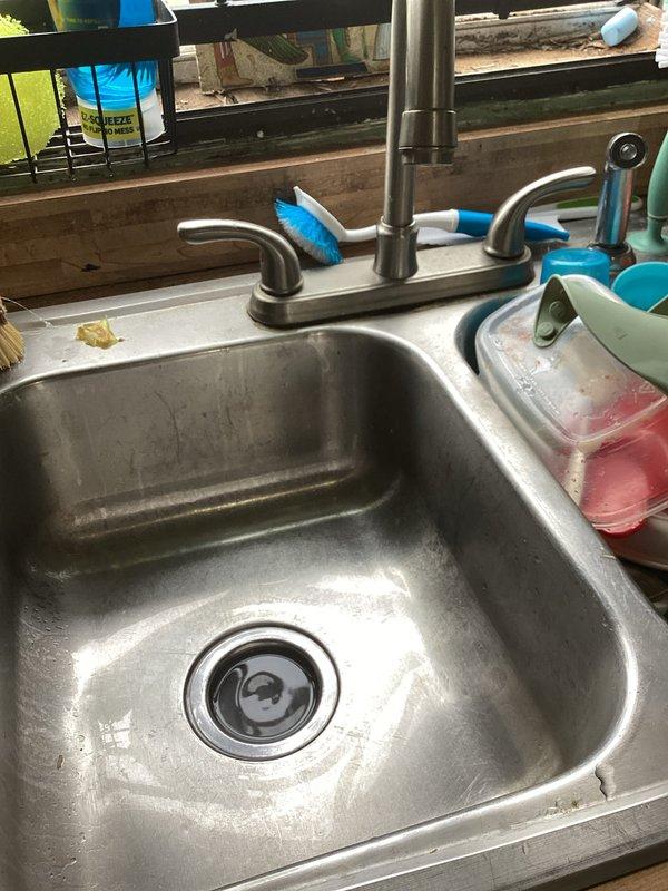Responded to service call for two slow-draining fixtures in residence. Successfully cleared and treated one kitchen sink and one bathroom sink using professional-grade drain treatment product activated with hot water. Both drains restored to proper flow rate, with treatment applied to dissolve grease buildup and organic matter causing the blockages.