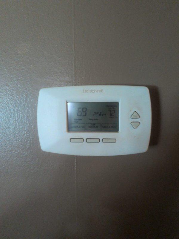 Completed monthly HVAC maintenance service including system inspection, thermostat verification showing proper operation at 69°F current/75°F setpoint, and replacement of 20x20x1 air filter. Inspected outdoor unit electrical components including capacitor and contactor connections, all found secure and operational.