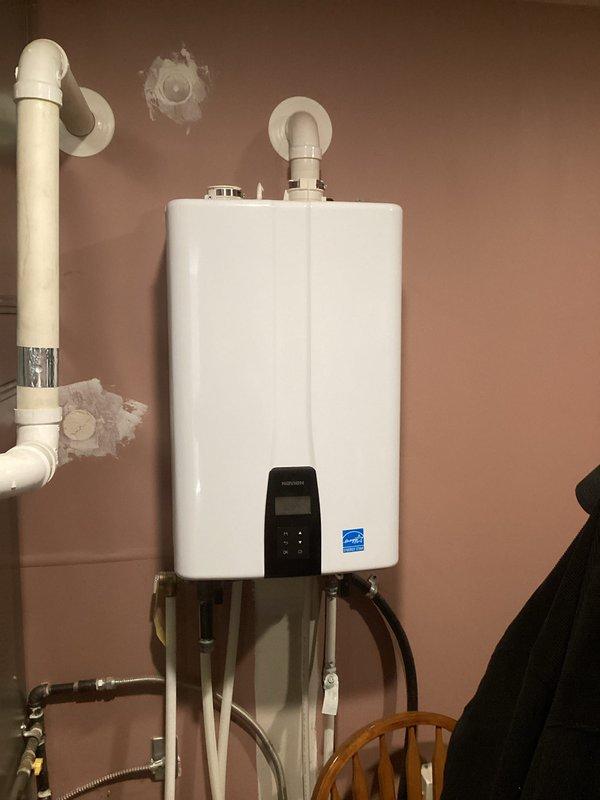 Performed heating maintenance service on HVAC system. Inspected existing 20x20x4 air filter dated 02/24/22 and noted customer's comfort club membership had expired but service was owed. Filter size 20x20x4 was not included in standard service package and customer did not have replacement on hand. Verified filter compartment specifications and documented current filter condition. Also observed tankless water heater installation during service visit, noting proper venting connections and plumbing configuration. System operational at time of departure.