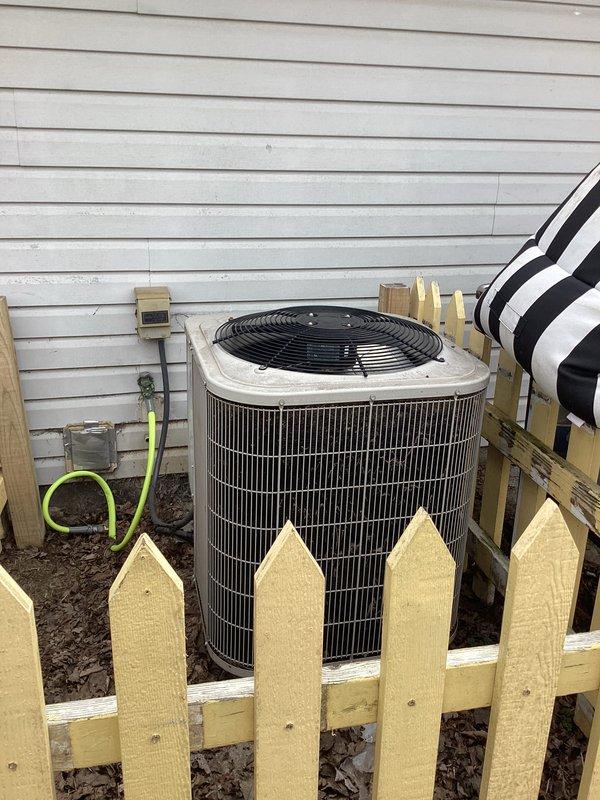 Completed cooling season preventive maintenance on residential air conditioning system. Performed comprehensive inspection of outdoor condensing unit, verified proper operation of all components, and checked refrigerant levels. Replaced 13x21.5x1 air filter to ensure optimal airflow and system efficiency. Confirmed thermostat operation with display reading 73°F and proper communication with cooling equipment. System operating within normal parameters with maintenance contract renewed through 10/1/26.