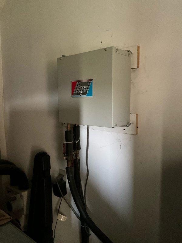 Conducted comprehensive site assessment for geothermal system installation at residential property. Evaluated existing mechanical room infrastructure, photographed current HVAC equipment configuration including water heater, existing heating system components, and available space for geothermal heat pump installation. Documented existing piping arrangements, electrical panel accessibility, and utility connections to determine system sizing requirements and installation feasibility. Assessed ground loop field requirements based on property characteristics and heating/cooling load calculations. Prepared detailed equipment specifications and installation proposal for complete geothermal heating and cooling system replacement.