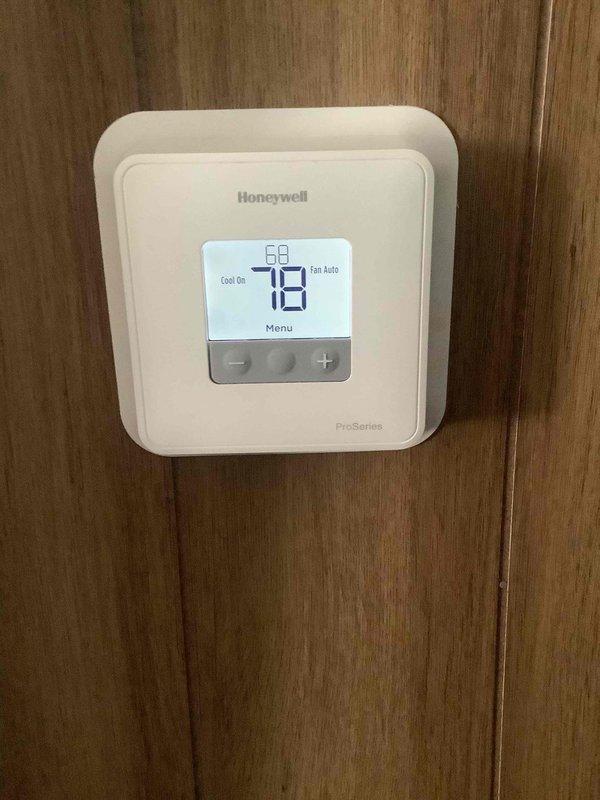 Responded to no cooling complaint with outdoor unit running but no indoor cooling. Performed diagnostic evaluation of Carrier air handler and condensing unit. Verified thermostat calling for cooling at 78°F setpoint with system in cooling mode and fan set to auto. Identified lack of airflow from indoor unit despite outdoor condenser operation, indicating potential blower motor failure, control board issue, or loss of communication between components. System requires further troubleshooting to isolate failed component and restore cooling operation.