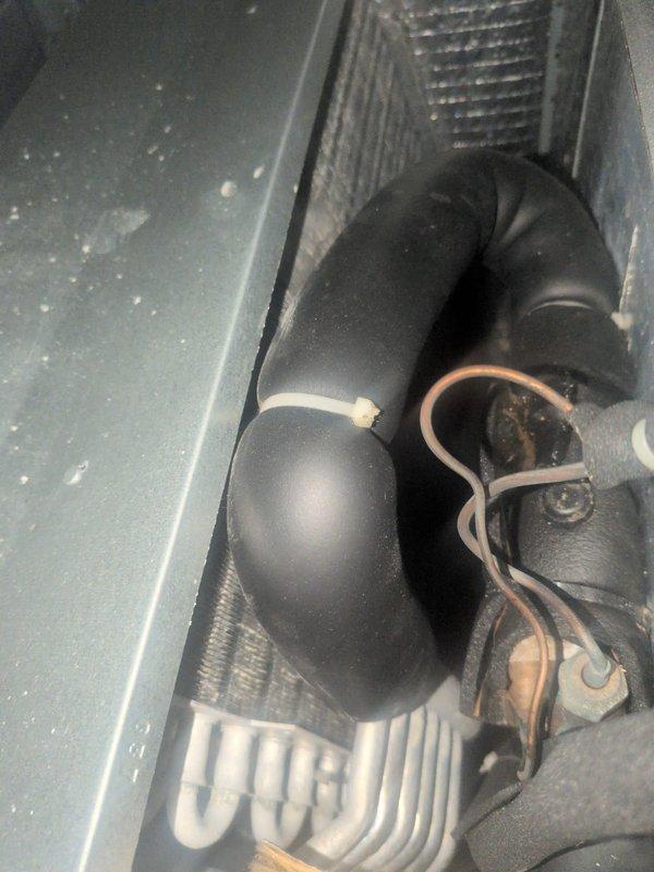 Completed basic monthly heating maintenance on HVAC system. Verified thermostat operation showing proper heat mode functionality at 70°F setpoint. Inspected air handling unit interior, including flexible connector assembly and internal components, documenting current system condition with no immediate service needs identified at this time.