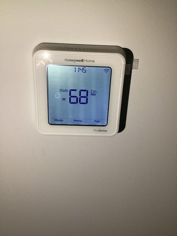Completed basic monthly HVAC maintenance on heating system. Inspected air handler unit, thermostat operation, and associated components. System found operating within normal parameters with thermostat displaying proper temperature readings and controls functioning correctly.