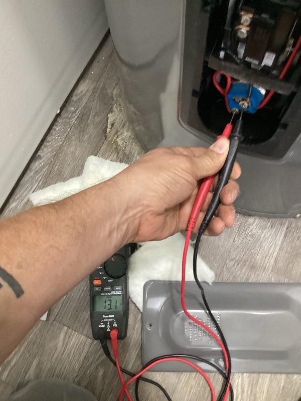 Responded to callback for water heater continuing to trip circuit breaker. Performed electrical diagnostics using multimeter to test voltage and continuity at water heater unit and electrical connections. Measured 13.1 reading during testing process. Inspected main electrical panel and verified circuit breaker assignments, including water heater circuit identification. Service provided complimentary as follow-up to previous visit, with issue documented for further evaluation.